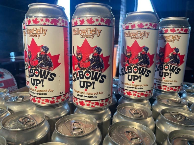 Cans of beer with the slogan "Elbows Up"